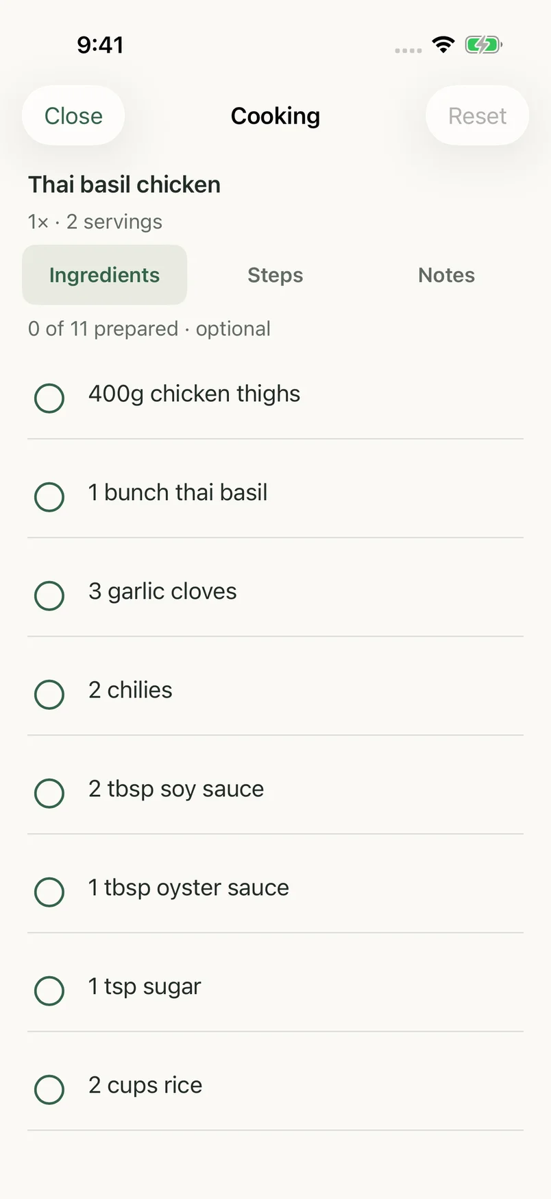 RecipeSnag cooking view on iPhone, with ingredients to check off and a Steps tab.